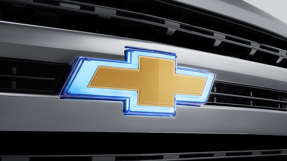 Emblema Chevrolet iluminado dorado