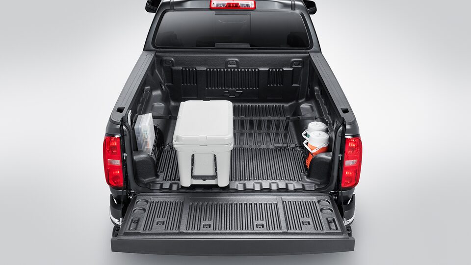 Bed liner con compartimiento de carga y red divisora